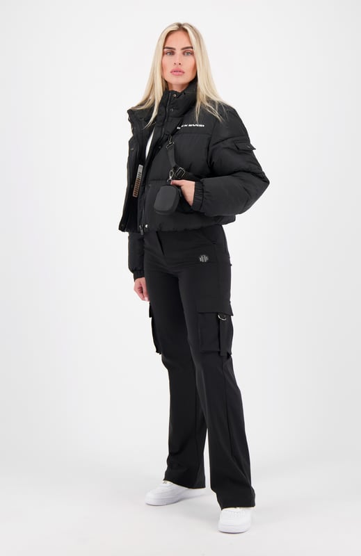 100% Polyester Short fit High collar with zipper and button closure BLCK BNNS logo on left chest Two front pockets Adjustable cuffs Side pocket on left arm Detachable zipper pouch 