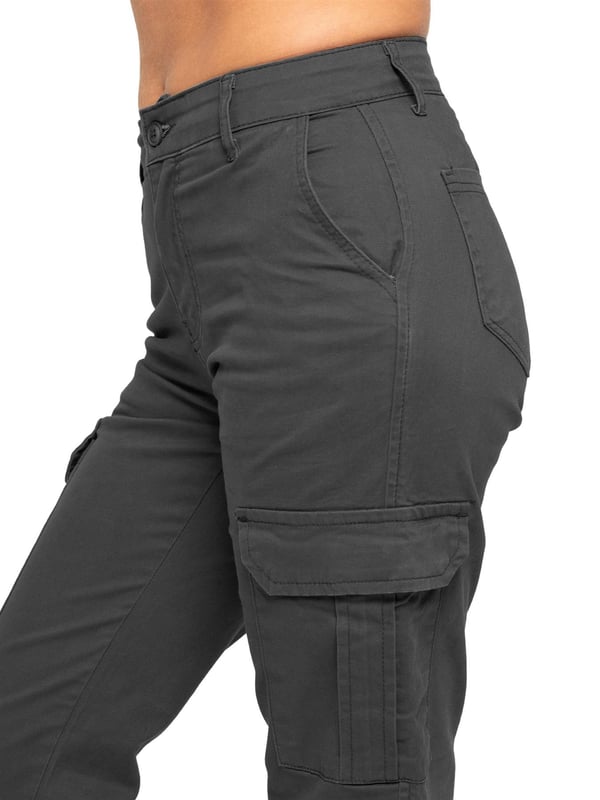 Enzo Women's Stretch Cargo Denim Jeans feature a straight-leg, regular fit design. They come with 2 front slash pockets, 2 side cargo pockets secured with Velcro fastening, and 2 back pockets for added convenience. The jeans have a zip fly closure and are perfect for both casual wear and workwear.