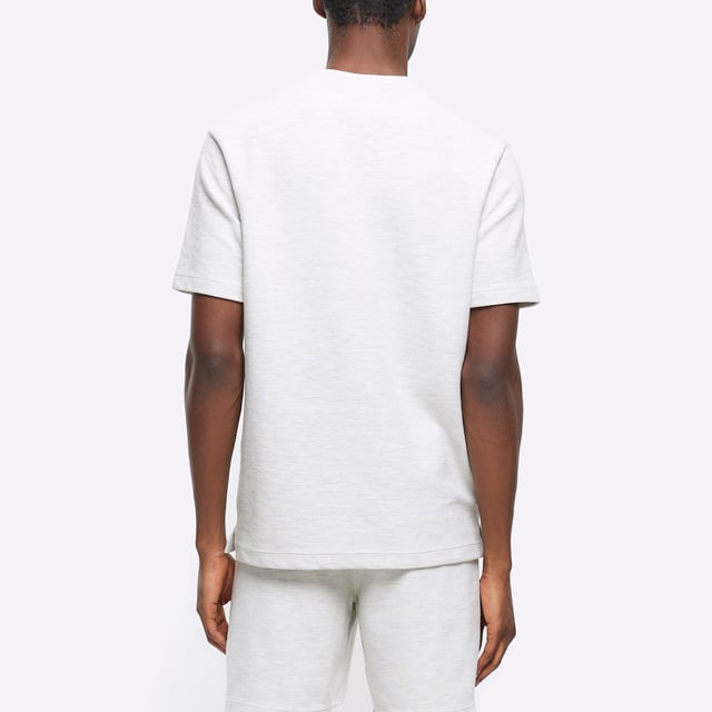Regular fit, Textured fabric, Chest pocket, Crew neckline, Short sleeves, Cotton for this product has been more responsibly sourced