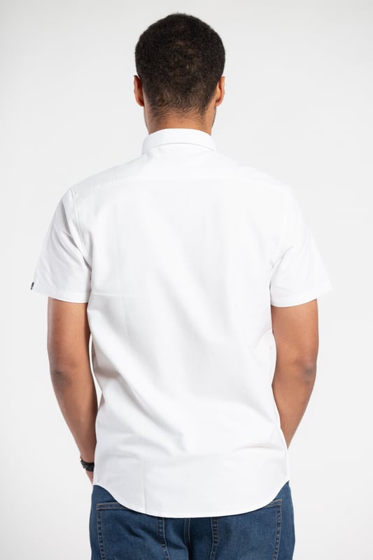 Elevate your casual style with this oxford shirt from Tokyo Laundry. Made from 100% cotton, this short-sleeved shirt is perfect for any occasion. The classic design features a comfortable fit and button fastening. Add this versatile staple to your wardrobe today. Machine washable for easy care.