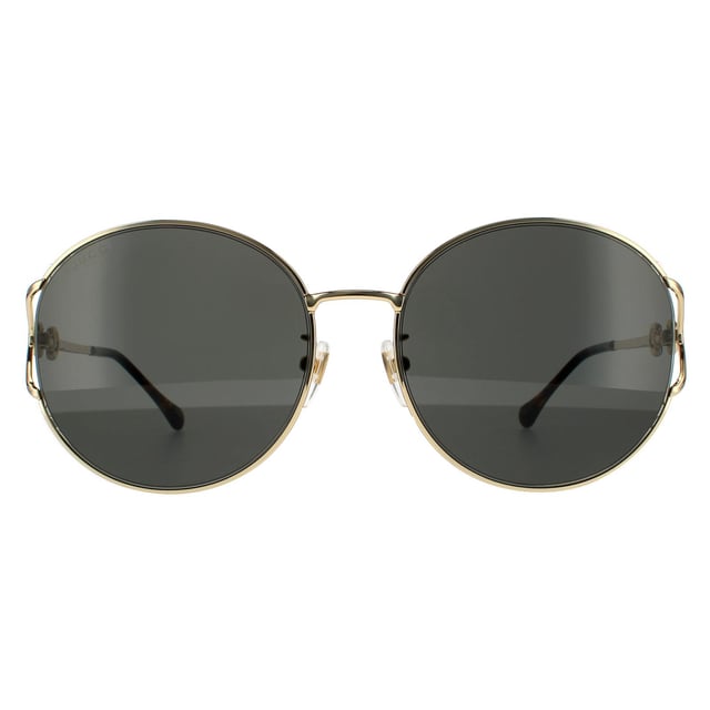 Gucci zonnebrillen GG1017SK 001 Gold Gray zijn een ongelooflijk glamoureus randloos ronde frame. De verstelbare neuskussens en plastic tempeltips zorgen voor een comfortabele de hele dag fit. De tempels geven het Gucci -logo voor merkherkenning