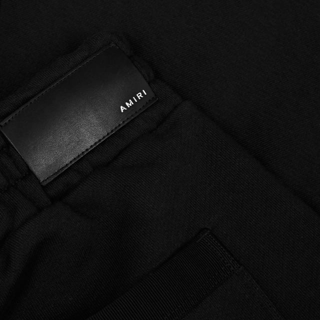 Amiri MA Logo Black Sweatshorts. Amiri Black Sweatshorts. 100% Cotton Shorts, Branded Side Label. Elasticated Waistband With Drawstring Fasten. Two Side Pockets and One Back Pocket. Style: PF22MJP038 763