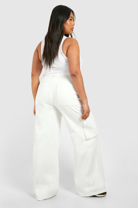 Wide-leg silhouette for a relaxed, on-trend look
        Cargo-style pockets add functional flair
        High-waisted design for a flattering fit
        Denim fabric offers durability and comfort
        Plus-size fit ensures inclusive styling
    
    Make a bold statement with these ecru cargo jeans, perfect for the fashion-forward woman who values both style and comfort. The wide-leg cut creates a relaxed silhouette that's right on trend, while the high-waisted design accentuates your curves in all the right places. Cargo pockets add a utilitarian edge, making these jeans as practical as they are stylish. Pair them with a cropped top and oversized coat for a chic, layered look that's ideal for casual outings or family gatherings. For a more laid-back vibe, team with a simple tee and trainers. The versatile denim fabric ensures these jeans will become a go-to piece in your wardrobe, easily transitioning from day to night with a simple change of accessories. Embrace the cargo trend and showcase your unique style with these must-have jeans from Boohoo.