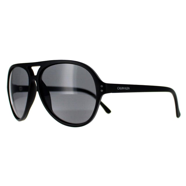 Calvin Klein Aviator Mens Matte Black  Grey CK19532S  Sunglasses are a sleek and versatile shades, boasting a timeless design that effortlessly complements any look. Crafted with precision, the lightweight frame provides comfort while exuding durability, making them perfect for everyday wear. The lenses not only offer superior UV protection but also add a touch of allure. Embrace a blend of fashion and functionality with these sunglasses, a must have accessory for those seeking elegance with an edge.