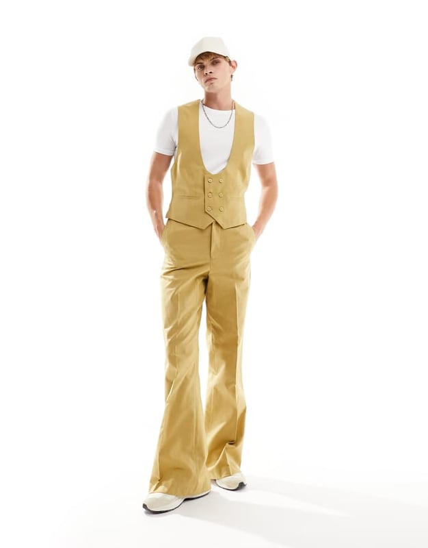 Suits by ASOS DESIGN Do the smart thing Scoop neck Button placket Pocket details Contrast back with an adjustable cinch Regular fitSold By: Asos