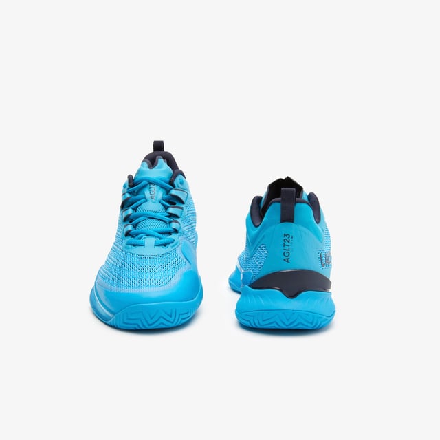 A new model this season  the AG-LT23 Ultra is designed to push tennis players’ abilities further than ever before with their lightweight and responsive design. From the Pebax technology that provides energy return  via the LSRFoam forefoot midsole  in combination with the enhanced stability offered from the TPU Plate Chassis and Heel Stabiliser  to the engineered breathable leno ‘Pique’ weave mesh upper for enhanced fit & breathability  they’re the innovative shoe every player needs to up their game. The outsole features Lacoste's brand new rubber compound; LineGrip. - Pro level performance Tennis shoe offering enhanced stability - Engineered breathable leno ‘Pique’ weave mesh upper for enhanced fit & breathability - Internal midfoot lockdown cage - Lacoste Super Responsive (LSR) Foam midsole in the Forefoot - High Performance EVA Foam in the Heel for enhances shock absorption - Full-length TPU plate chassis and heel stabilizer - 'LineGrip' Rubber Outsole - Ref: 745SFA001111C
