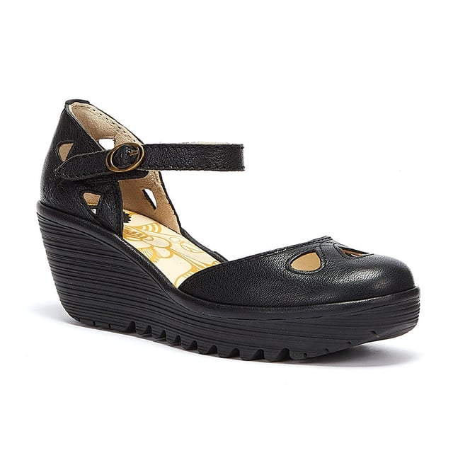 The Yuna from Fly London is a platform sandal with elevated heel. Features include premium materials, drop-shaped cut outs, and a round buckle fastening. Complete with signature Fly London branding.
