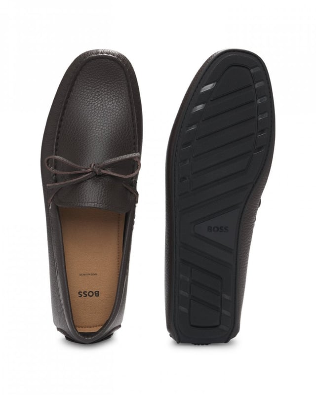 Slip-on moccasins with a durable driver outsole and bow vamp trim by BOSS Menswear. This pair is crafted in leather with a natural grain.

Fastening top: Slip-on
Fully lined
Packaging: Box

Upper material: 100% Cow skin, Lining: 90% Polyamid, 10% Polyurethane, Sole: 100% Thermoplastic polyurethane, Innersole: 90% Polyamid, 10% Polyurethane
50536247
 
