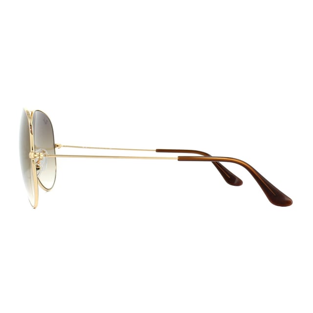 Ray-Ban Sunglasses Aviator 3025 Gold Brown Gradient 001/51 were originally designed in 1936 for US military pilots and have since become one of the most iconic sunglasses models in the world. The timeless design is characterised by the thin metal wire frame, large teardrop shaped lenses and fine metal temples that feature silicone tips and nose pads for a customised and comfortable fit. This classic model is available in various sizes and an array of colourways.