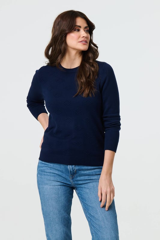 Get a classic look in this slim jumper. It has an embroidered texture on the front, long sleeves and a flattering hip length hem. For an effortless professional outfit, pair with a midi skirt or fitted trousers. This top is also made from a breathable viscose blend.