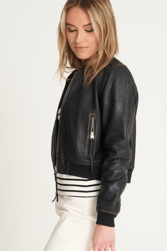 Introducing the Barneys Originals Washed Cropped Bomber Jacket – a fusion of contemporary style and timeless appeal. Crafted with textured leather, this jacket not only adds an edgy dimension but also offers a unique tactile experience. The cropped design adds a modern twist to the classic bomber silhouette, making it a versatile choice for any occasion. The washed finish lends a vintage charm, ensuring that each piece is distinctively yours. Elevate your fashion game with this Barneys Originals jacket – where texture meets trendsetting in a cropped bomber masterpiece.