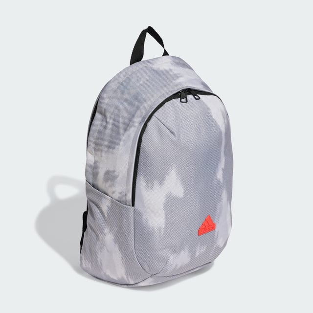 Weaving through city streets or escaping to the countryside, the adidas backpack makes a stylish yet practical choice. Padded, adjustable straps and a breathable mesh back panel ensure carrying comfort wherever the day takes you. Multiple pockets, inside and out, provide storage for life's essentials. This product is made with at least 50% recycled materials. By reusing materials that have already been created, adidas help to reduce waste and our reliance on finite resources and reduce the footprint of the products adidas make.  - Dimensions: 14.5 cm x 31 cm x 45 cm - Volume: 20.2 L - 100% polyester (recycled) - Mesh back panel and strap backing - Front zip pocket - Slip-in side pockets - Inner slip-in pocket - Padded adjustable shoulder straps - Carry handle  Shipped by adidas