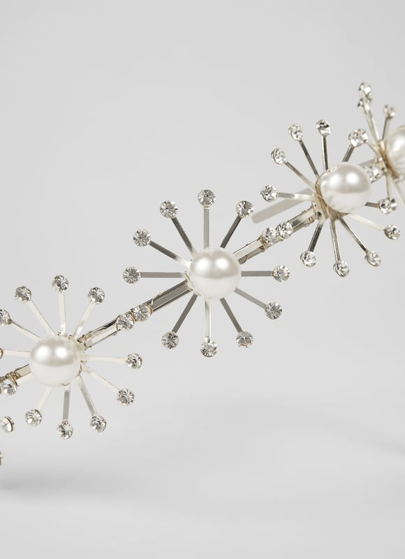 With something of a celestial feel, our Bethany headband is a brand new style in our Bridal Collection. Beautifully hand-crafted in Britain from silver-tone metal and graphic star bursts in pearl and small clear crystals, this statement bridal hair accessory is the perfect partner to your LKB wedding dress.