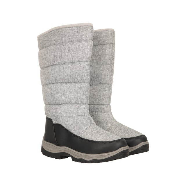 Upper: Durable, Textile, Water Resistant. Lining: Fleece, Insulating, Sherpa, Textile. Outsole: Synthetic. Fabric Technology: Snowproof. Flat Heel. Cut: Mid Calf. Design: Logo, Quilted. Toe Style: Round. Fastening: Side Zip, Slip-on.