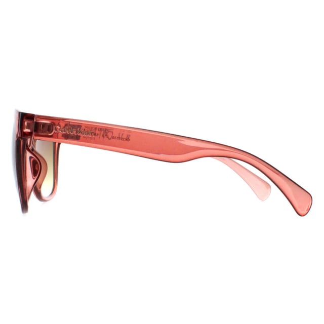 Calvin Klein Square Womens Transparent Brown Brown Gradient CK22553S  Sunglasses feature a chic square frame, crafted from high-quality acetate for a luxurious and comfortable feel. The design is accentuated by subtle detailing that adds a touch of glamour without overwhelming the minimalist aesthetic. The lenses provide complete UV protection, ensuring your eyes are shielded from harmful rays while offering excellent visual clarity.