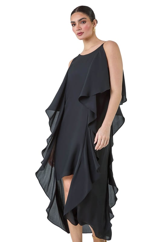 Plain Dipped Hem Ruffle Detail Midi Dress from Roman. Elevate your Summer wardrobe with this striking ruffle detail midi dress from the Ariella range. Featuring a elegant, cascading waterfall ruffle detail, this dress has a striking hi-low silhouette to add a touch of drama to your occasionwear. This sleeveless dress with a concealed back zip fastening is crafted from plain woven fabric and fully lined for maximum comfort. The metal trim on the shoulder straps provides a sophisticated edge. Whether you're attending a wedding or a formal dinner, style it with strappy heels and a clutch bag for event-ready glamour!