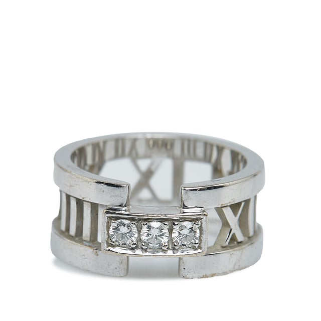 VINTAGE. RRP AS NEW. The Atlas ring features a roman numerals in white gold-tone hardware with diamonds.Exterior Front Discolored, Scratched. Exterior Back Scratched. Exterior Bottom Scratched. Exterior Top Scratched. 

Dimensions:
Length 6cm
Width 2cm

Original Accessories: This item has no other original accessories.

Color: Silver
Material: Metal x White Gold
Country of Origin: Italy
Boutique Reference: SSU234791K1342


Product Rating: GoodCondition

Certificate of Authenticity is available upon request with no extra fee required. Please contact our customer service team.