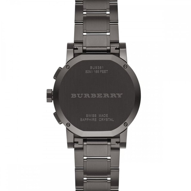 Introducing the Burberry Watch, model BU9381, a harmonious blend of functionality and sleek design. This watch features a robust gunmetal stainless steel bracelet and a complementary dark grey dial. The unidirectional rotating bezel adds a sporty touch, while the chronograph subdials and date display provide practical functionality. Swiss-made precision ensures reliable timekeeping within this sophisticated timepiece. It's an emblem of Burberry's commitment to luxury and performance, crafted for those who demand both style and substance in their accessories. Specification Details Brand Burberry Model BU9381 Barcode Number 822138035095 Gender Unisex Case Diameter 42 mm Case Material Stainless Steel Case Colour Gunmetal Dial Colour Dark Grey Band Material Stainless Steel Band Colour Gunmetal Movement Swiss Quartz Water Resistance 5 ATM Features Chronograph, Date Indicator, Unidirectional Rotating Bezel