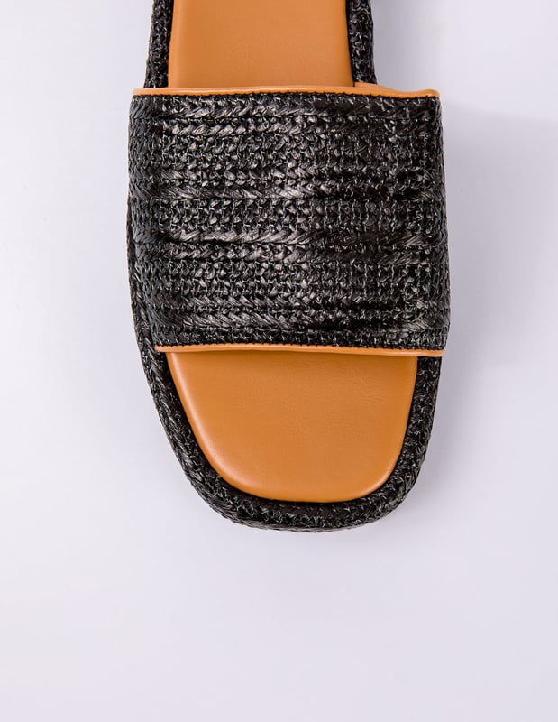 Espadrille soles and woven details make these black sandals a stylish pick on sunny-weather days. Comfort is key, and these sliders provide everything you need in a summer time slider!