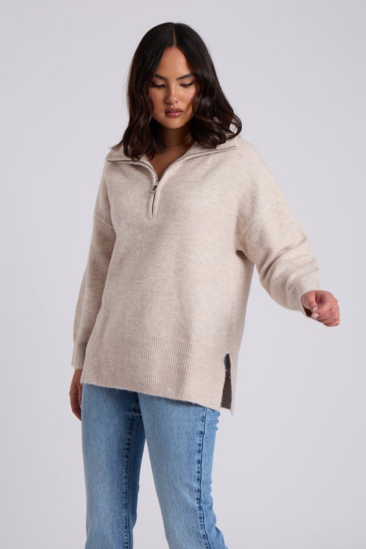 Model is 5'6 and wears a size 8. Crafted with utmost attention to detail, the Oatmeal Plain Oversized Half Zip boasts a relaxed and flattering oversized fit that drapes elegantly, providing a cosy and stylish look for any occasion. Its soothing creates a sense of sophistication, making it a timeless piece that can effortlessly transition from season to season.