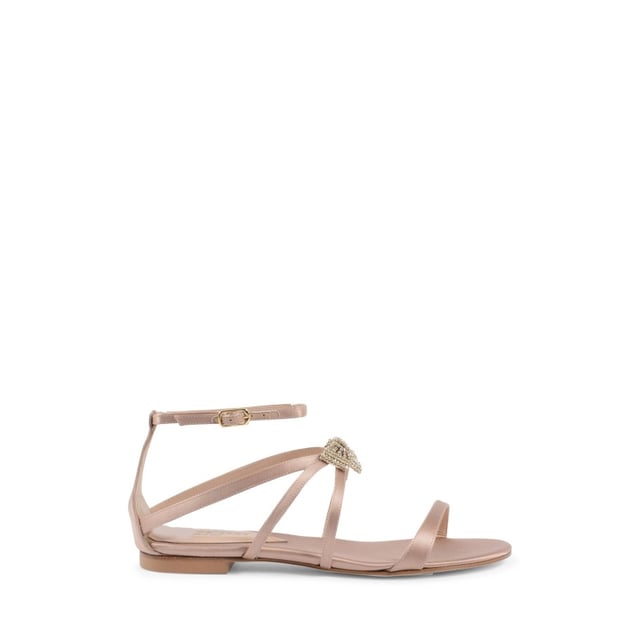 Nicole Sandal Nude This small swarovski bow applied on the instep will make this low satin sandal with ankle strap sparkle. Made by the best Italian artisans. 100% Made in Italy. 100% SATIN Made in Italy Low Heel
