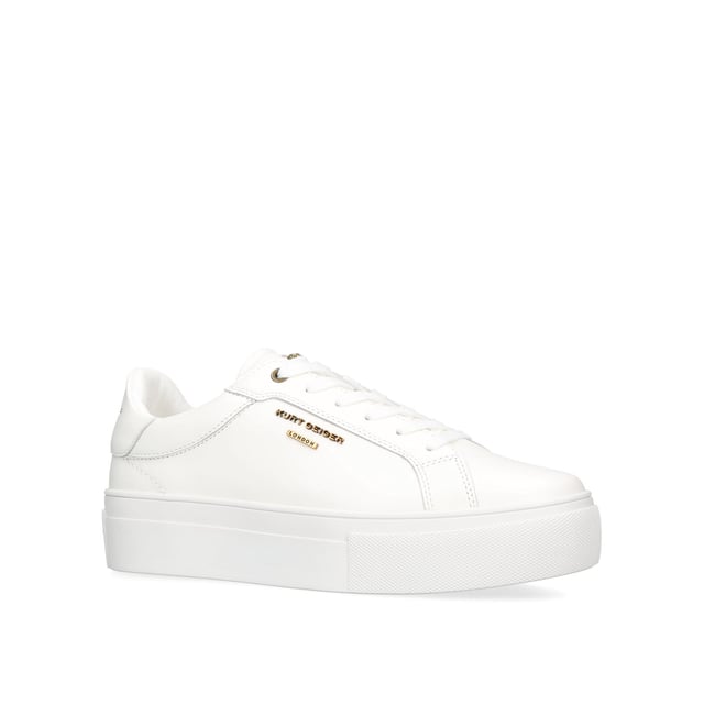 This Kurt Geiger Greenwich Cupsole sneaker features a white leather upper with lace up fastening. There is antiqued brass branding on the eye stay and micro head eagle on the tongue. Sole height: 4cm.