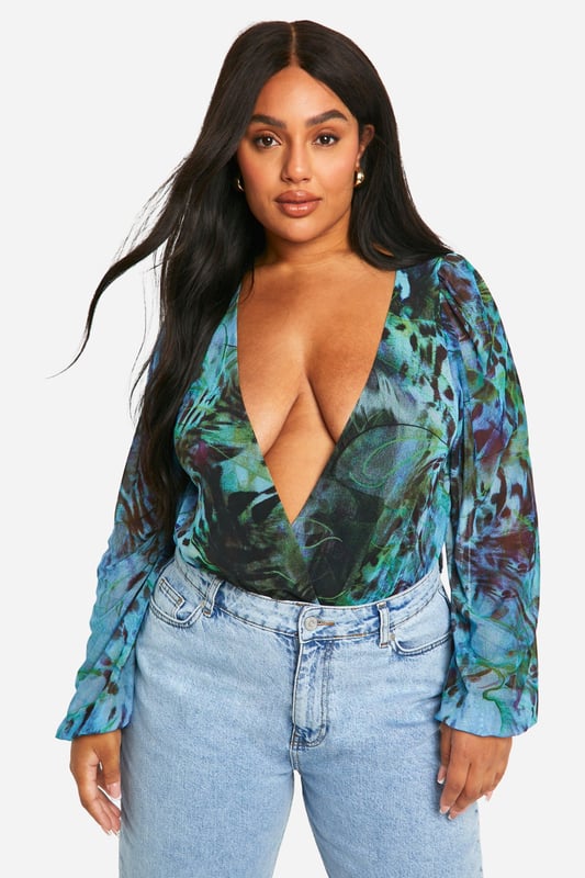 Plus Animal Wrap Mesh Bodysuit Update your wardrobe with this plus size bodysuit from our dedicated curve range. A form fitting, curve enhancing style with a press-stud fastening, this piece can be dressed up or down, depending on the vibe. Team with coated jeans and statement heels for date night plans, or pair with tailored trousers for a brunch date with your bestie. For an instant fresh 'fit, a plus size black bodysuit is perfect to replace your go-to t shirts. Got a date night planned? Team a dreamy plus size lace bodysuit with a leather skirt and standout heels.Style: BodysuitDesign: AnimalSleeve Length: Long Sleeve