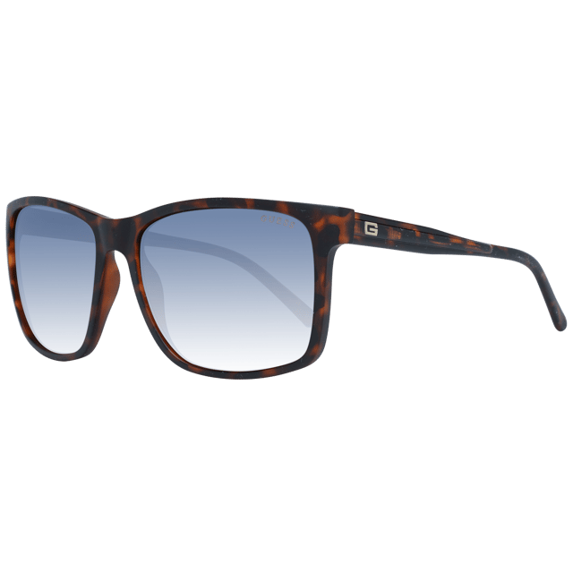 Las gafas de sol Guess GF5082 52F marrón degradado tienen una montura cuadrada clásica que transmite una sensación de elegancia atemporal. La montura está hecha de acetato de alta calidad, conocido por su durabilidad y ligereza, lo que garantiza una comodidad duradera durante todo el día. Las patillas finas incorporan el logotipo de Guess para dar un toque de sofisticación.