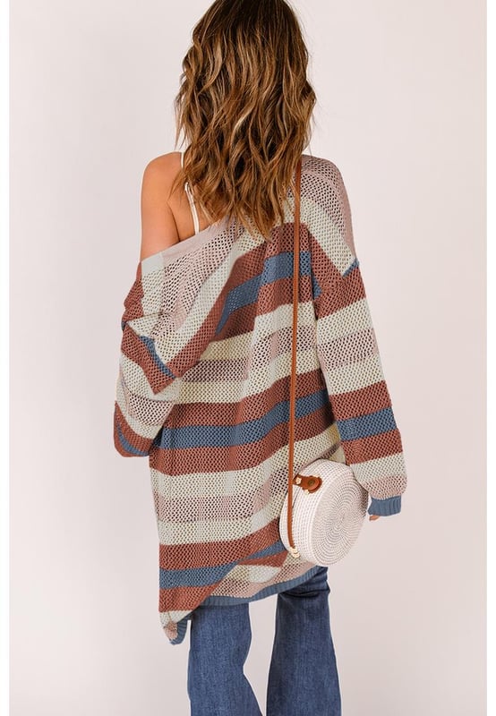 Striped color block design
  Hollowed knit pattern
  Made for women
  Relaxed fit
  Versatile and stylish
  Comfortable fabric
  Perfect for layering
  Elevates any outfit
Material: 55% Acrylic 45% Cotton
