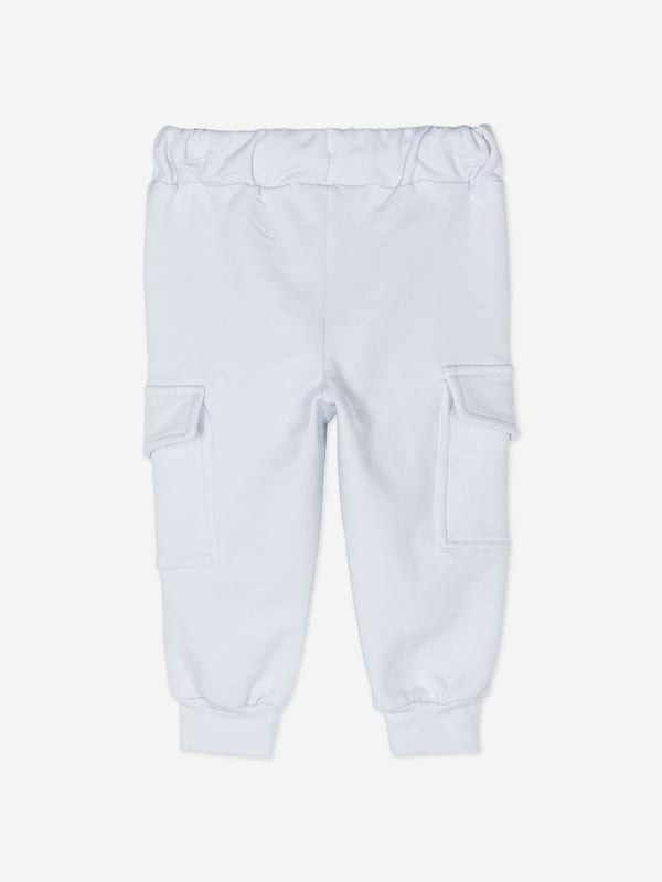Introducing the Baby Boys Cargo Trousers in Blue from patachou, a luxurious addition for AW2024. Crafted with precision, these trousers are a perfect blend of elegance and comfort for your little one. Key highlights:‚ Rich Blue Hue: A deep, captivating blue that complements any outfit.‚ Premium Fabric: Constructed with high-quality materials for durability and comfort.‚ Versatile Design: Featuring practical cargo pockets and a stylish, adaptable fit.Elevate your child's wardrobe with these chic and functional cargo trousers!