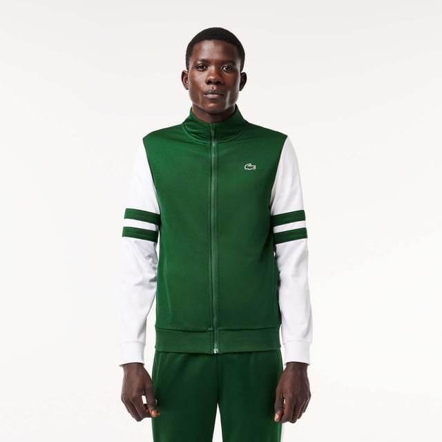 Designed for Tennis  for a regular frequency of use This product is in Interlock which guarantees you a resistant fabric making it adapted to high repetitive movements during training sessions. This sweatshirt is made in 100% recycled polyester and has 2 zipped hand pockets to secure your personal items. Classic fit: comfortable ease on body  with comfortable sleeves The technical capsule offers the complete seasonal wardrobe on and off court with a strong design identity. LACOSTE wording print at back neckline.