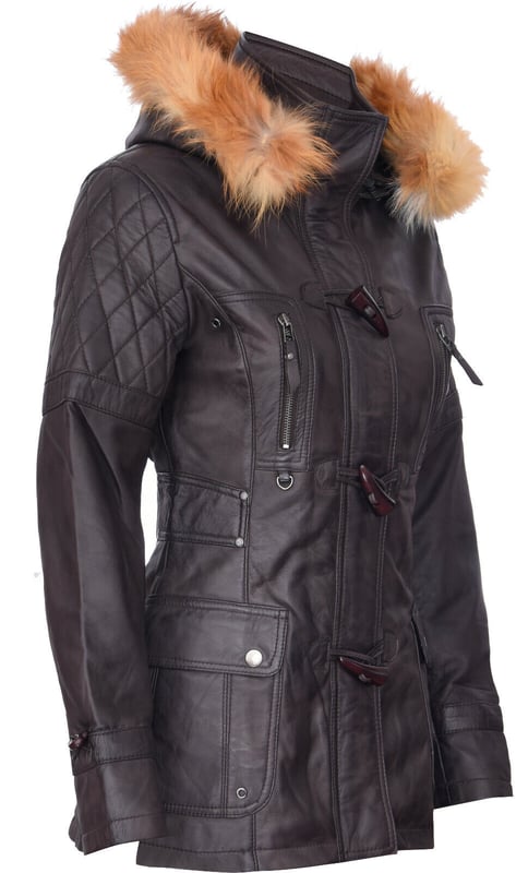 Elevate your winter wardrobe with our luxurious Women's Leather Diamond Quilted Parka Jacket, designed to add exuberance to your cold-weather outfits. Crafted from 100% premium ultra-soft nappa leather, this jacket offers a comfortable and luxurious feel. Here's what sets it apart:  
Diamond Quilting: The jacket features luxurious diamond quilting that adds a stylish texture to the ultra-soft leather, creating a unique and visually appealing design. 
Detachable Fur-Lined Hood: For extra warmth and a touch of class, the jacket comes with a detachable fur-lined hood, providing both comfort and style. 
High Funnel Collar: Below the hood, a high funnel collar shields against the wind and can be fastened with a traditional toggle closing, offering added protection and elegance. 
Multiple Pockets: This jacket offers practicality with two flap pockets at the waist and additional vertically running zipped pockets across the breast, ensuring you have ample storage space for your essentials. 
Quilted Detailing: Quilted detailing on the shoulders, back, and hood enhances the overall design, adding sophistication and warmth to the jacket.  This Women's Leather Diamond Quilted Parka Jacket is the perfect choice for those seeking both style and functionality in their winter attire