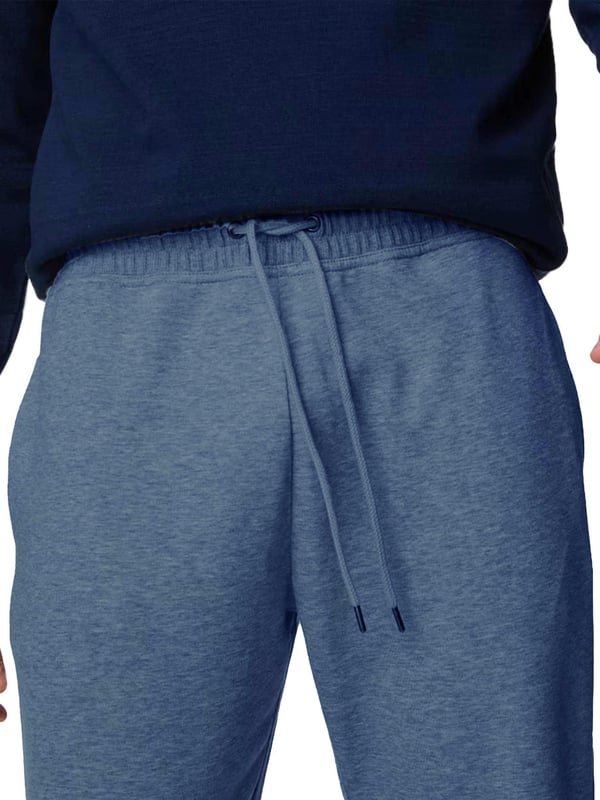 The Kruze Open Hem Joggers offer the perfect blend of comfort and functionality. Designed with an open hem for a laid-back look, these joggers feature a ribbed, elasticated waistband with adjustable drawstrings for a secure, customized fit. Practicality is ensured with two concealed side zip pockets and a single back zip welt pocket, providing secure storage for your essentials. Crafted with soft fleece lining, these joggers promise warmth and comfort, making them ideal for both lounging and casual outings