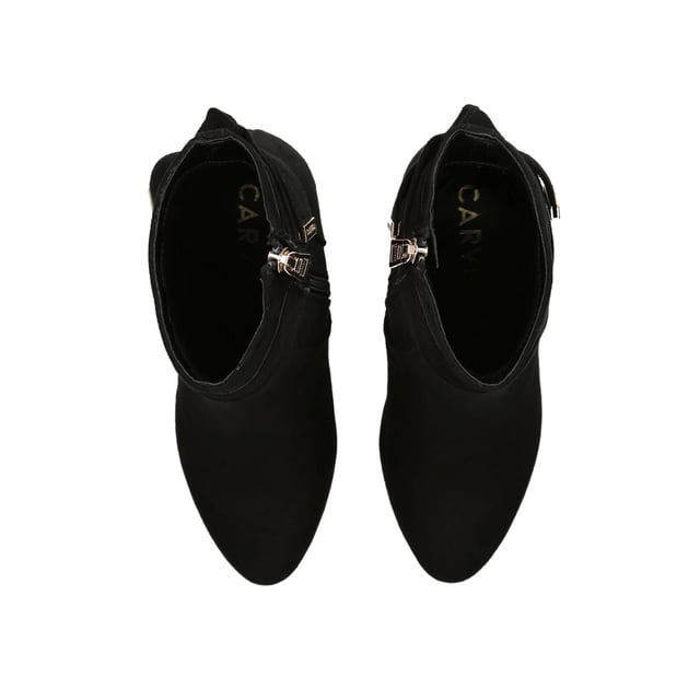 The Carvela Tempt ankle boot features a black microsuede upper. There is a bow detail at the back of the ankle with gold tone branding. The inner side of the ankle features a zip for comfort. Heel height: 90mm.