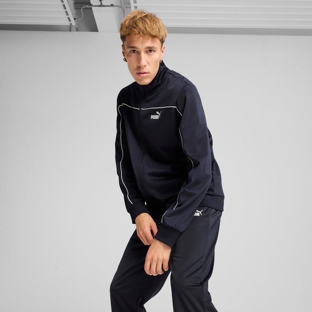 PRODUCT STORY: These everyday essentials feature a high-collar jacket with rib cuffs and waistband, plus pants with an elastic waistband and internal drawcord for customized comfort. PUMA No. 1 Logo rubber prints and piping details complete the look. FEATURES & BENEFITS: Made with at least 90% recycled materials. DETAILS: Regular fit; High-collar; Elastic waistband with internal drawcord; Ribbed cuffs; Closed bottom; PUMA branding details; 100% polyester Recycled - tricot - 220.00 g/m - piece dyed - Mechanical - Brushing, Mechanical - UPFMain Material 3: 100% polyester Recycled - tricot - 220.00 g/m - piece dyed - Mechanical - Brushing, Mechanical - UPF.  Our model is 180 cm tall and is wearing size M UK.