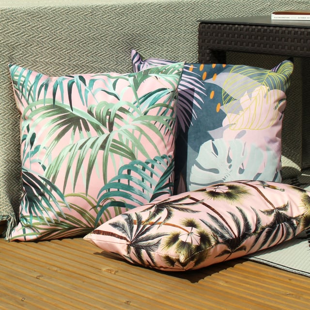 Featuring a bold and abstract design of palm leaves. There is a fully reversible design in pastel pinks and bright green's will instantly freshen up your outdoor space.