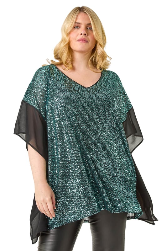Curve Full Sequin Chiffon Overlay Top from Roman. Unleash your inner glam goddess with the sequin overlay top! This dazzling top features an all over sequin design with a delicate chiffon trim overlay, adding a touch of elegance. The V-Neckline and below hip length create a flattering silhouette that's perfect for special occasions. Pair it with pleather trousers and heeled boots to create a show-stopping party look that will turn heads all night long!