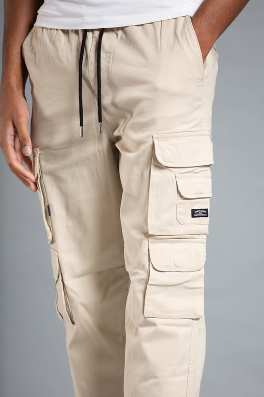 These cargo-style trousers from Tokyo Laundry are wardrobe staples. Made from soft cotton fabric, these trousers are perfect for everyday wear. Featuring two side pockets, four cargo-style pockets and two back pockets, a drawstring with toggle, elasticated waistband and cuffs and Tokyo Laundry branding on the front. Machine washable for easy care.