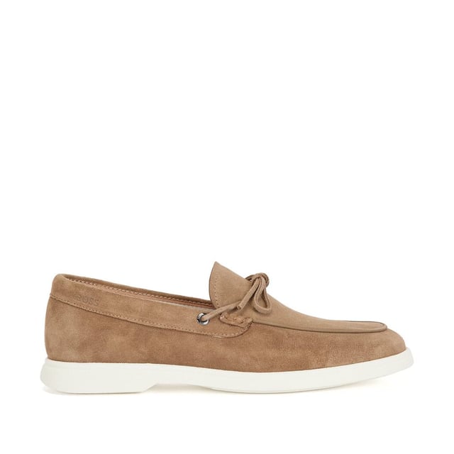 . A slip on shoe with suede uppers featuring decorative tassels across the vamp in brown suede and all over brown stitch details. Two silver branded eyelets situated on the outstep and instep with the signature BOSS logo embossed on the outstep of the heel. A textured rubber midsole in off white with a branded and textured rubber undresole in off white.