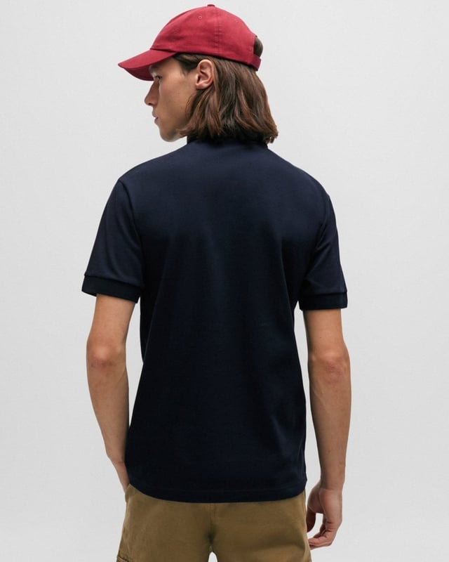 A slim-fitting polo shirt with short sleeves by BOSS Menswear, crafted in soft piqué with a tonal logo patch. By purchasing this product, you are contributing to protecting the environment and sustainable cotton farming in Africa. CmiA is committed to improving the living and working conditions of African cotton farmers and to preserving nature.
Slim fitFlat-knit collarNumber of buttons: 3Short sleevesFlat-knit cuffs
95% Cotton, 5% Elastane
50507803