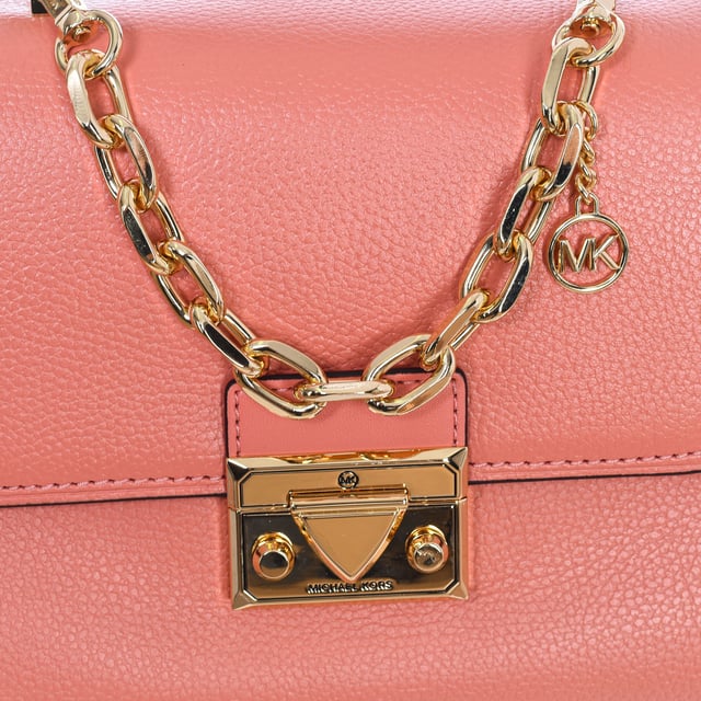 Michael Kors handbag.
 This bag will complete any look with refined charm. It contains a variety of pockets and a snap closure to keep your essentials secure. Combine it with the ultra-feminine looks of the season.
 Handbag.
 100% leather.
 Hardware in gold tones.
 Interior details: Back zipper pocket, front pocket with opening.
 Seams seen in tone.
 Includes removable strap.
 Measures: 23cm (W) x 18cm (H) x 7cm (D)
 Composition: 100% Cow skin
 Care:
Clean with a wet cloth.