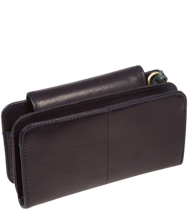 The 'Little Wonder' cross body clutch bag from Conkca London is handcrafted from multi-toned leather for a beautiful finish. A magnetic press-stud secured cover opens to reveal a compartment ideal for a smartphone. A zip-over top opens to reveal a second compartment that is perfect for your essential items and has three handy card slots. Lined with natural and untreated 100% cotton. It comes with an adjustable leather strap with a maximum drop length of 68cm, which is removable, converting the bag into a clutch bag. Adorned with the inimitable Conkca squirrel charm and Conkca logos.