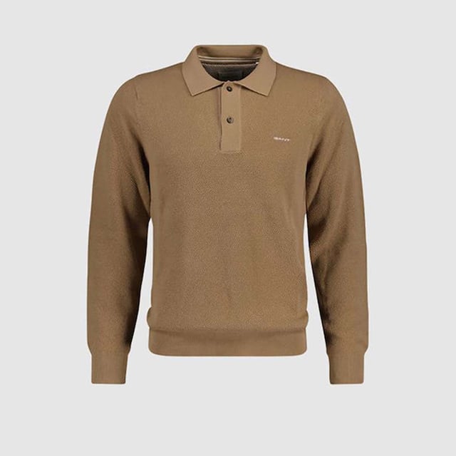 This versatile sweater from GANT is knitted from 100% cotton in a lightweight piqué structure. Designed for a regular fit  it features long sleeves  a polo collar and buttoned placket. This piece is made complete with ribbed detailing at the hem and cuffs  and a GANT logo embroidered at the chest. Wear it with everything from jeans to chinos.  By choosing our cotton products  you’re supporting GANT's investment in Better Cotton’s mission. This product is sourced via a system of mass balance and therefore may not contain Better Cotton. Read more on bettercotton.org-massbalance.Regular fit- Long sleeves- Polo collar and placket- Rib detailing at hem and cuffs- Contrast stripe detail on inside neck- GANT logo embroidered at chest- Wash with similar colors. Wash inside out. Reshape while wet. Iron back into shape.