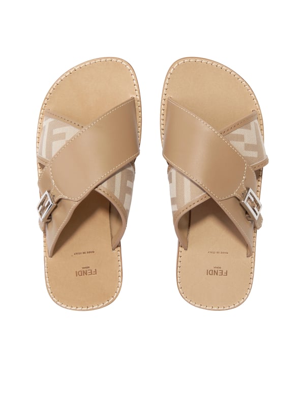 Introducing the high-end symbol of elegance, the Girls Leather FF Logo Sandals in Beige by Fendi. This Italian-made designer footwear is perfect for your little fashionista's Summer look. Here are the standout features: Italian Craftsmanship: Immaculately designed in Italy for a durable and long-lasting wear. Signature FF Logo: The trendy FF Logo by Fendi adorns the sandals adding a distinguished style statement. Supreme Comfort: Created with high-grade leather ensuring a comfortable stride on all summer adventures. Upgrade Your Wardrobe: Enlighten your girl's collection with the chic FF Logo Sandals in Beige. Shop now for distinct elegance and timeless style!
