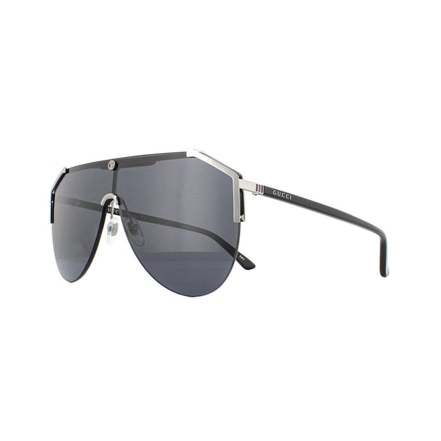 Gucci Sunglasses GG0584S 001 Ruthenium and Black Grey are a bold design featuring one visor aviator shaped lens. Crafted from metal and plastic with adjustable nose pads for comfort. The interlocking GG logo is located front and centre with the Gucci text logo on each temple.