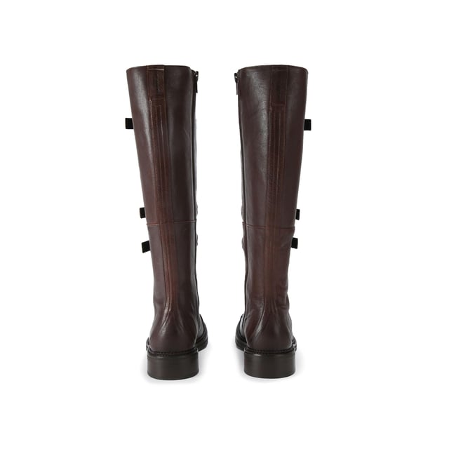 This Kurt Geiger Monument Strap Boot is crafted from a brown leather. There are three buckled straps across the front of the boot and a lace up detail at the bottom. There is a statement antiqued silver oval trim with eagle head at the centre with all over crystal detail attached to the laces.
