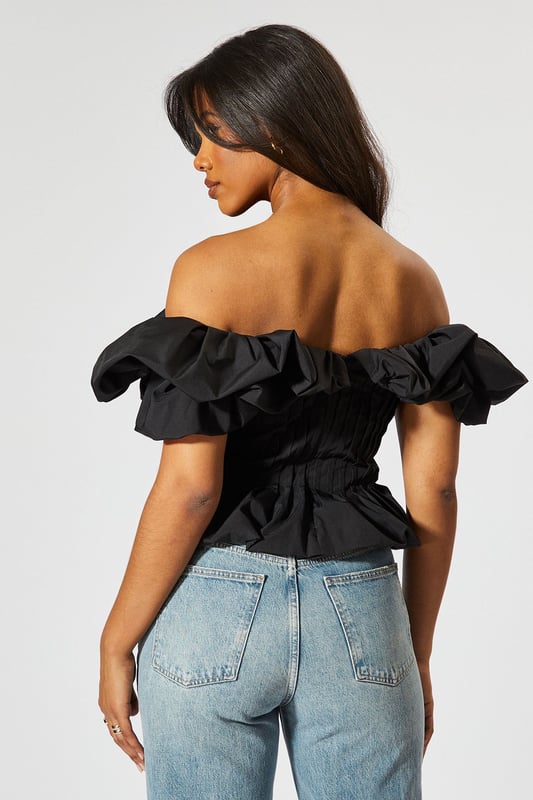 Striking bardot neckline with ruffle detail
        Cinched waist for a flattering silhouette
        Off-shoulder design with short sleeves
        Textured fabric with vertical pleating
        Cropped length perfect for high-waisted bottoms
    
    Make a statement with this eye-catching Ruffle Bardot Cinched Waist Top from MissPap. The off-shoulder design with its dramatic ruffle detail creates a captivating look that's sure to turn heads. The cinched waist accentuates your figure, while the vertical pleating adds texture and interest. Perfect for those who love to be the centre of attention, this top pairs beautifully with high-waisted jeans for a casual yet stylish ensemble. Dress it up with a sleek skirt and heels for a night out, or keep it relaxed with wide-leg trousers and trainers for a chic daytime look. Whether you're heading to a family gathering or meeting friends for drinks, this versatile piece allows you to customise your style to suit any casual occasion. The cropped length is ideal for showing off your favourite bottoms, making it a must-have addition to your wardrobe.