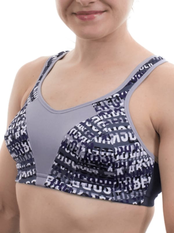 Shock Absorber Multi Sports Bra. Crop design with sports bra support, full back opening and racer back. With adjustable padded straps and powermesh side panels. Product is recommended hand-wash only..