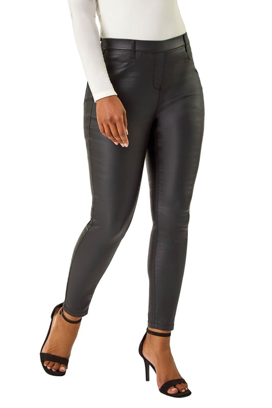 Petite Coated Pull On Jeggings from Roman. Prepare for the cooler season style with our Petite coated jeggings. Featuring a thin waistband for easy pull-on wear, these jeggings are crafted from a comfortable stretch woven fabric, offering a perfect fit for an all-day outfit. Designed with patch pockets in a trouser shape and coated appearance. Complete your look by pairing them with a trendy blouse, denim jacket, and ankle boots!