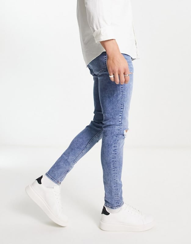 ASOS DESIGN super skinny jeans in mid wash blue with abrasions